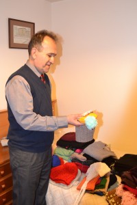 Father Ebrahim accepting clothes